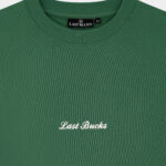 Close-up of the Last Bucks logo embroidery on The Signature Sweater in Hunter Green
