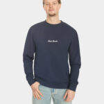 Model wearing the Last Bucks The Signature Sweater in Navy, front view