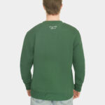 Model wearing the Last Bucks The Signature Sweater in Hunter Green, back view with knitted neck logo