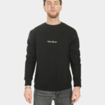 Model wearing the Last Bucks The Signature Sweater in Jet Black, front view