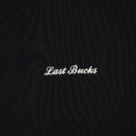 Close-up of the Last Bucks logo embroidery on The Signature Sweater in Jet Black