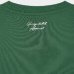 Close-up of the knitted "Unregulated Apparel" logo at the back neck on The Signature Sweater in Hunter Green