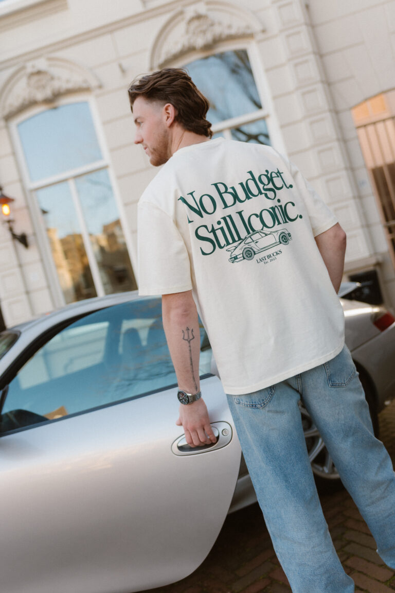 Man wearing No Budget Still Iconic tee by Last Bucks