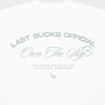 Back detail of the Own The Sky Tee in White showing the large tonal "Last Bucks Official" and "Own The Sky" graphic with LB mark