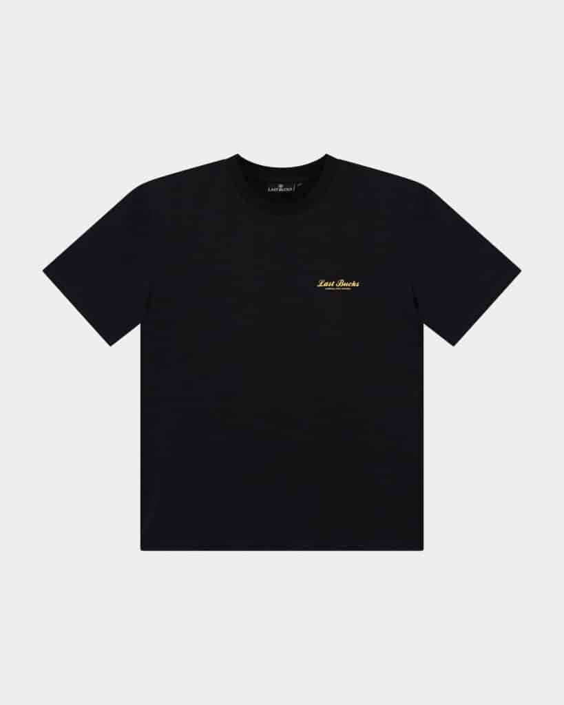 The Script Tee Jet Black - Black t-shirt front view with a small gold “Last Bucks” script logo on the left chest