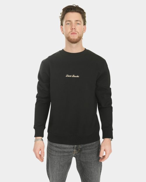 Model wearing the Last Bucks The Signature Sweater in Jet Black, front view
