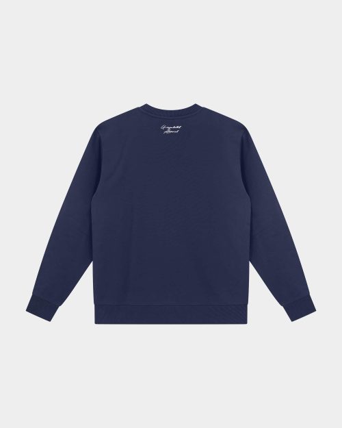 Signature Sweater Navy - Last Bucks The Signature Sweater in Navy, back view with knitted neck logo