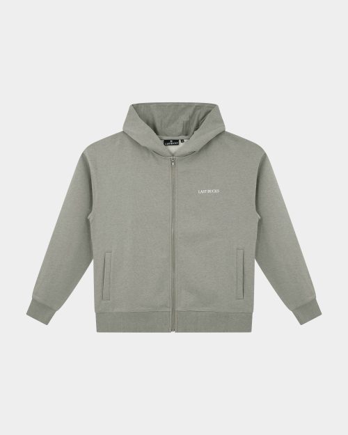 Capital Zip Hoodie Mari Grey - shown from the front on a plain background, featuring a full zip, hood, kangaroo-style side pockets, and a small "LAST BUCKS" chest logo