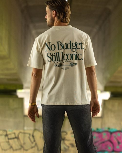 The Iconic Tee Off-White by Last Bucks worn from the back, with a classic coupe under the words No Budget. Still Iconic.